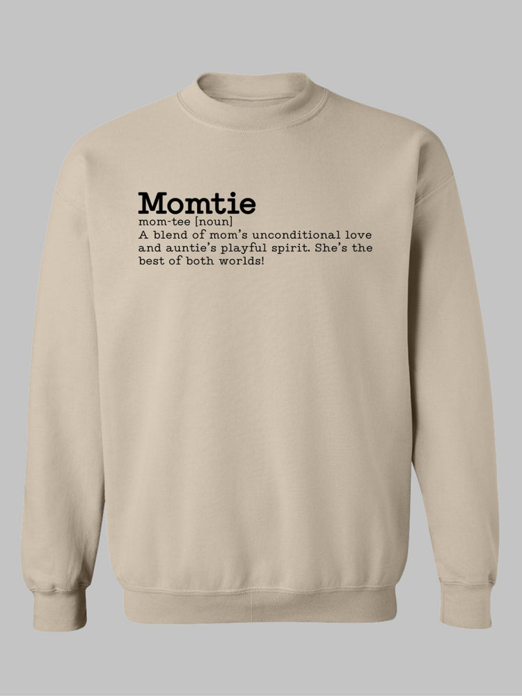 Beige crewneck sweatshirt featuring the word 'Momtie' in bold black text. Below it is a whimsical definition: 'mom-tee [noun] A blend of mom’s unconditional love and auntie’s playful spirit. She’s the best of both worlds! Momtie tshirt, Momtie sweatshirt, momtie hoodie, momtee hoodie, momtee sweatshirt, momtee tshirt 