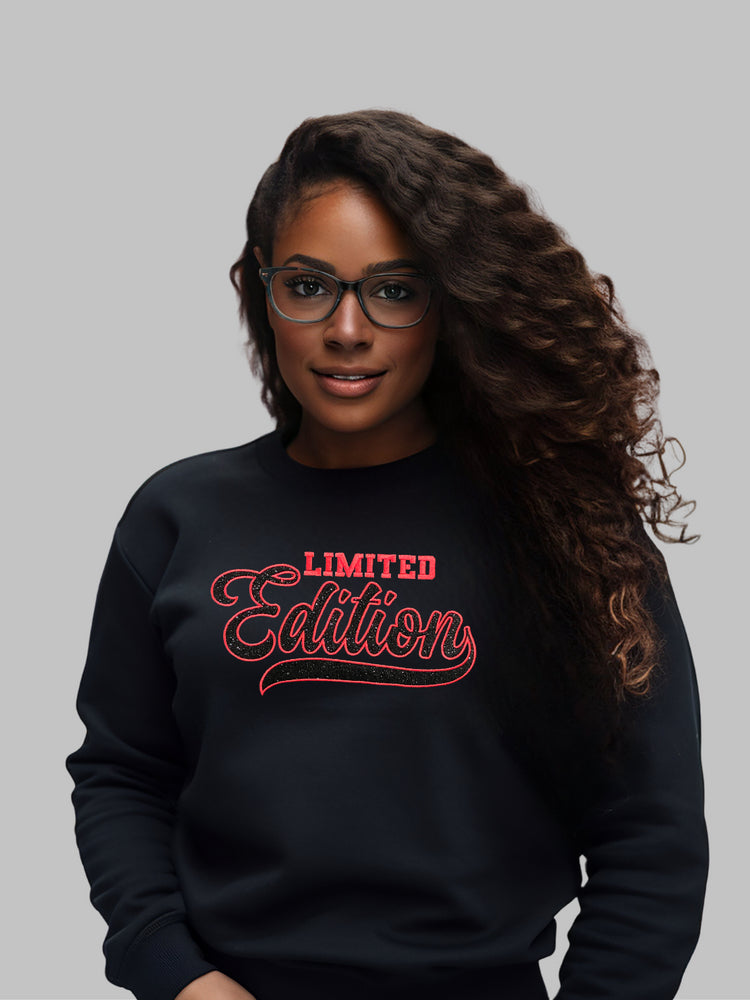 A black crewneck sweatshirt with 'Limited Edition' message in elegant black glitter appliqué embroidery and red satin stitch