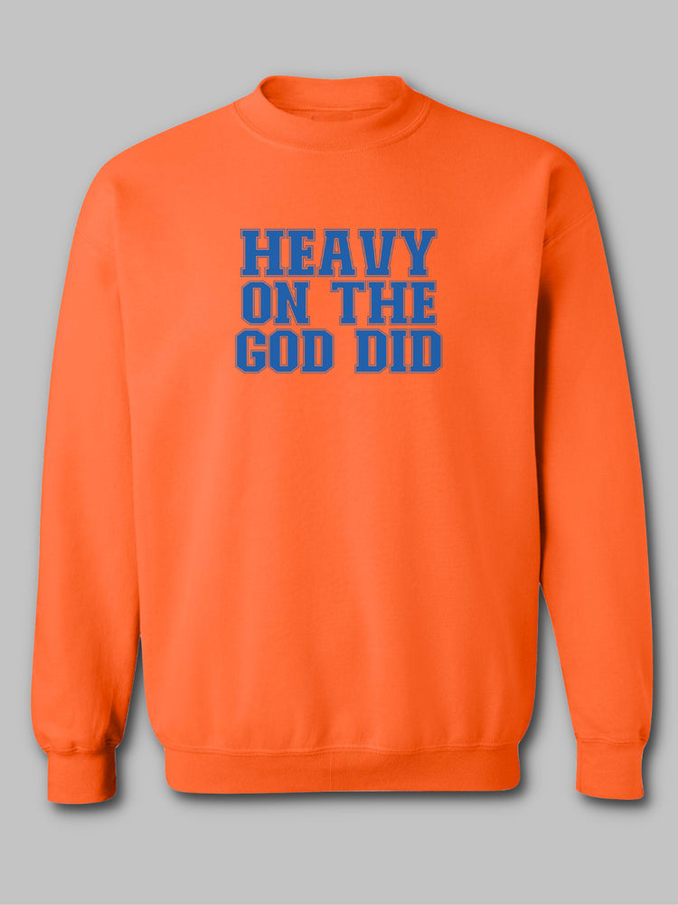 Image of a christian based vibrant orange crewneck sweatshirt with the phrase 'Heavy on the God Did' prominently displayed in bold, contrasting lettering. The text color, royal blue, stands out against the bright orange background, emphasizing the message of strong faith and divine intervention. The design reflects a bold statement of spiritual confidence and gratitude. Faith based. 